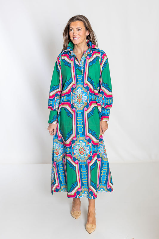 Woman wearing a colorful patterned dress on a white background
