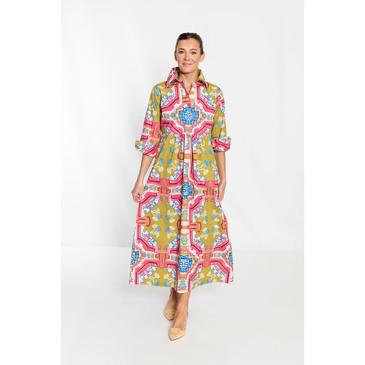 Woman wearing a colorful patterned dress on a white background