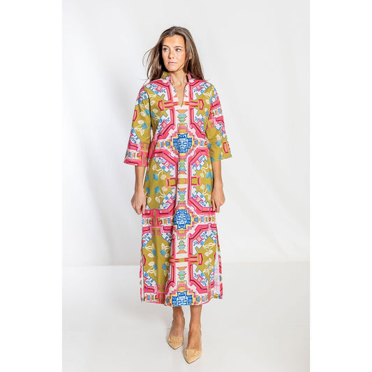 Woman wearing a colorful patterned dress on a white background